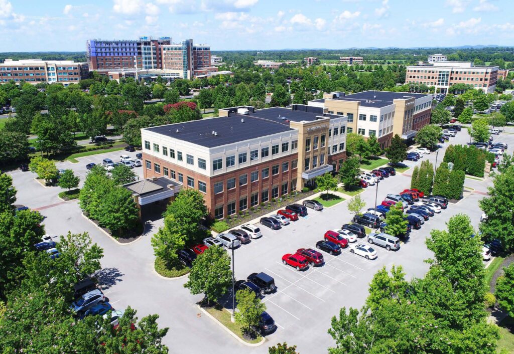 Aerial view of healthcare facilities and parking space.