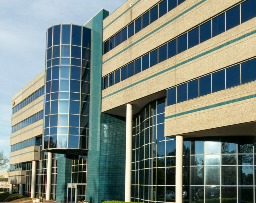 Front building entrance with circular glass atrium.